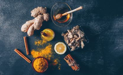 Ayurvedic herbs and spices- ginger, cinnamon, curcumin powder, honey and lime
