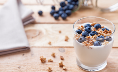 A glass of healthy yogurt, berries and granola