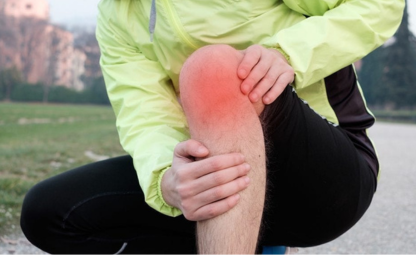 A person holding his knee due to joint pain