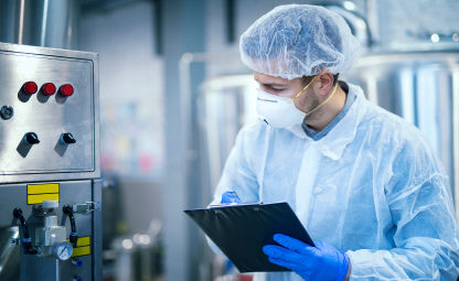 A person checking processing machine of food testing