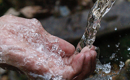 Water pouring on the hand 