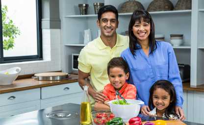 Family cooking healthy food together