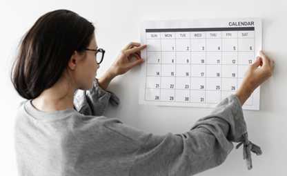 A woman checking the calendar