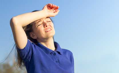 A person feeling exhausted due to heat