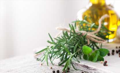 Herbs and spices tied together with oil in the glass container