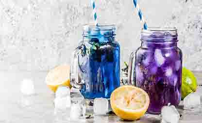 Blue Pea Flower Ice Tea in glass mugs with lemon and ice