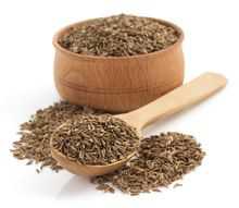 Brown Cumin seeds on a white table