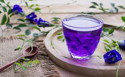 Blue Pea Tea on a wooden tray with Shankhpushpi/ Blue Pea Flower