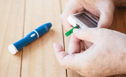 Taking a blood glucose test in a glucometer