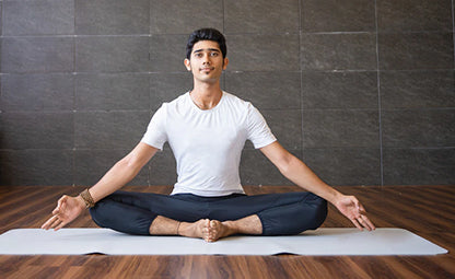 A stress-free man doing a yoga pose