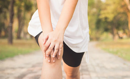 A person pressing knees due to joint pain