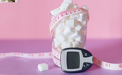 Artificial sweetener (sugar) in a glass container wrapped in measuring tape next to a glucometer