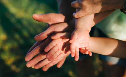 hands over hands of a family