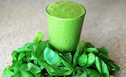 Glass of Moringa Juice with organic moringa leaves
