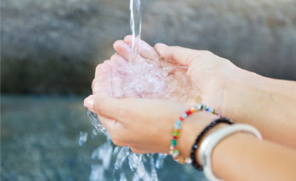 Pouring water on the hands