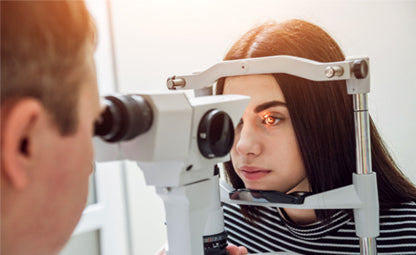 A doctor doing an eye check with the machine