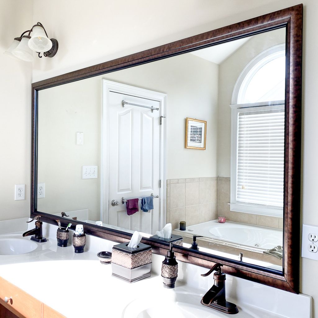 mirror facing window in bathroom