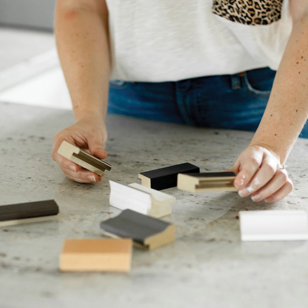 woman deciding between samples