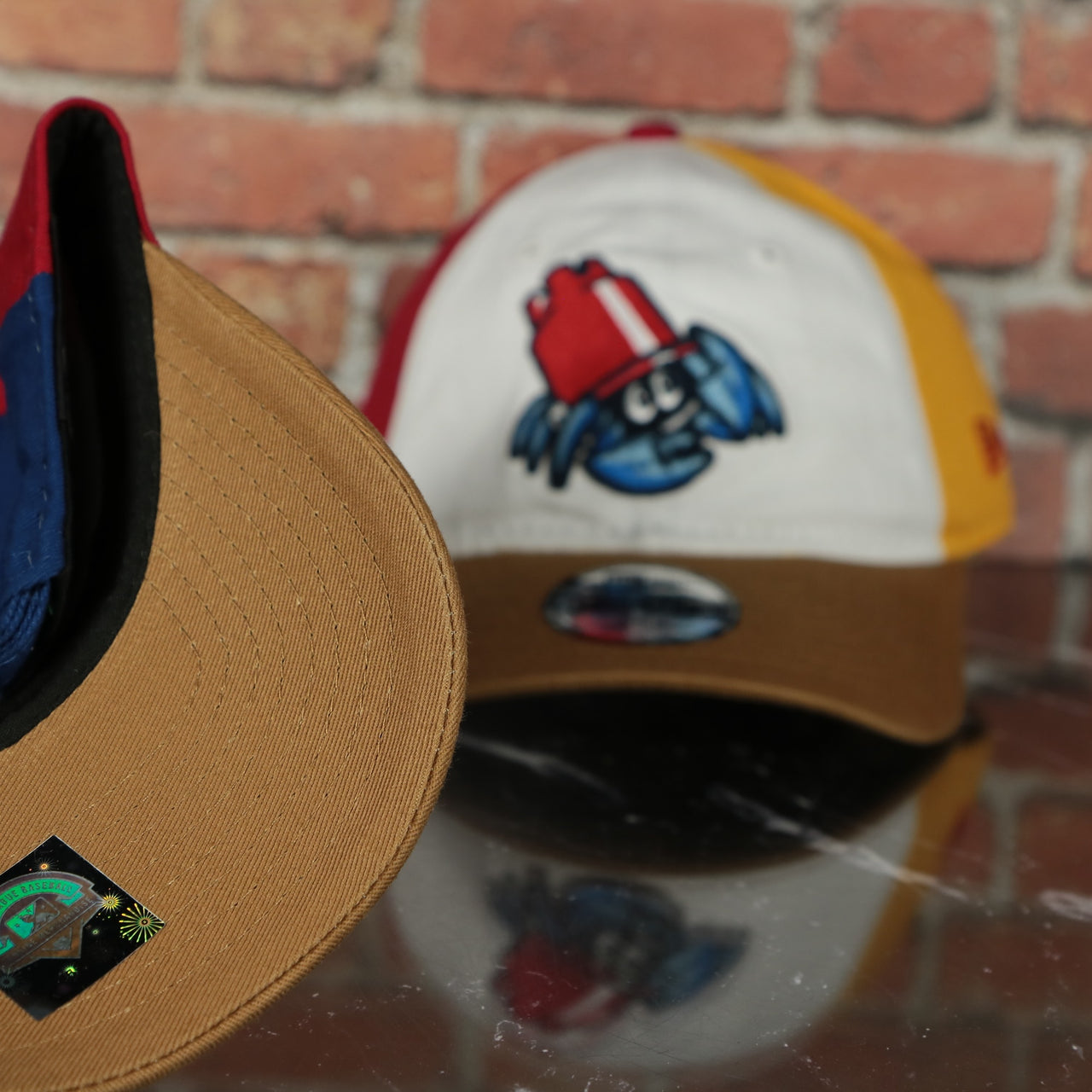 tan under visor on the Jersey Shore Blueclaws Bucket Blueclaw MiLB Tan bottom 4 Tone | White/Red/Tan/Royal 9Twenty Child Dad Hat