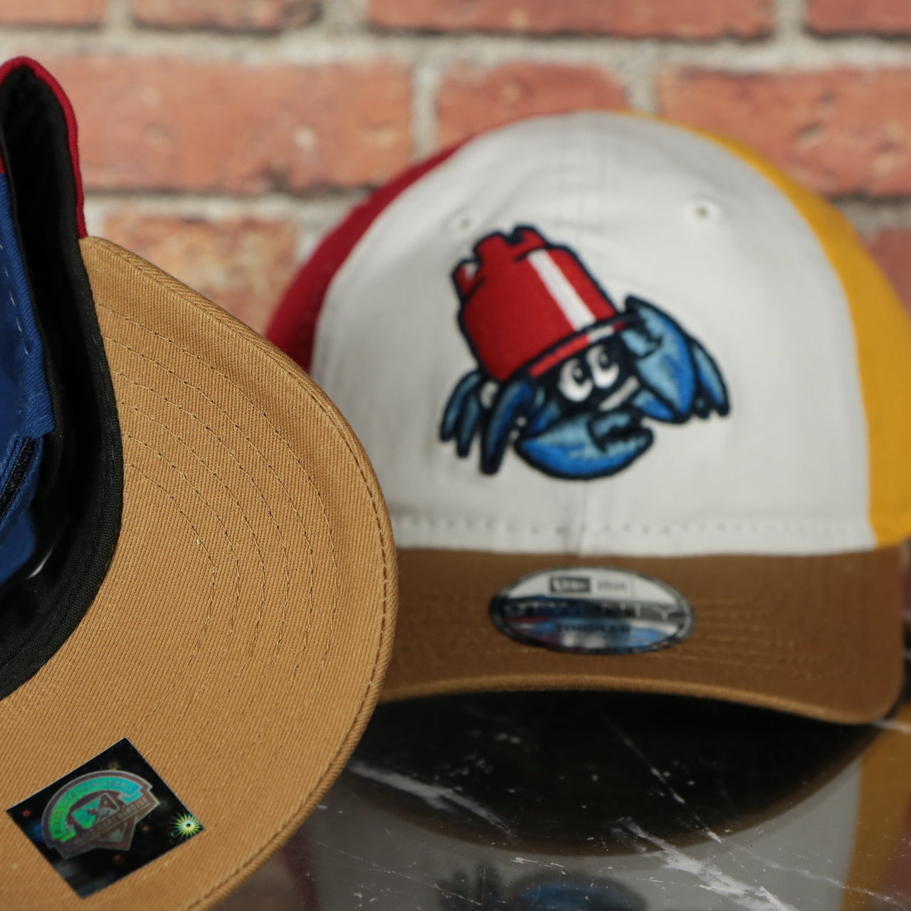 tan under visor on the Jersey Shore Blueclaws Bucket Blueclaw MiLB Tan bottom 4 Tone | White/Red/Tan/Royal 9Twenty Toddler Dad Hat