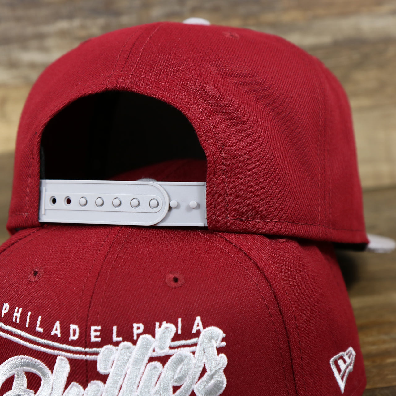 The backside of the Philadelphia Phillies Team Script Gray Bottom 9Fifty Snapback | Maroon And Grey Snap Cap