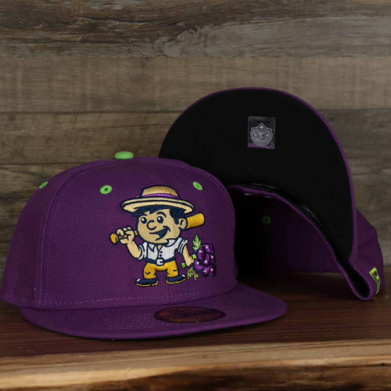 front and bottom of the Tri-City Dust Devils 2022 Vineros de Tri-City Copa de la Diversion On-Field Black Bottom 5950 Fitted Cap | Purple