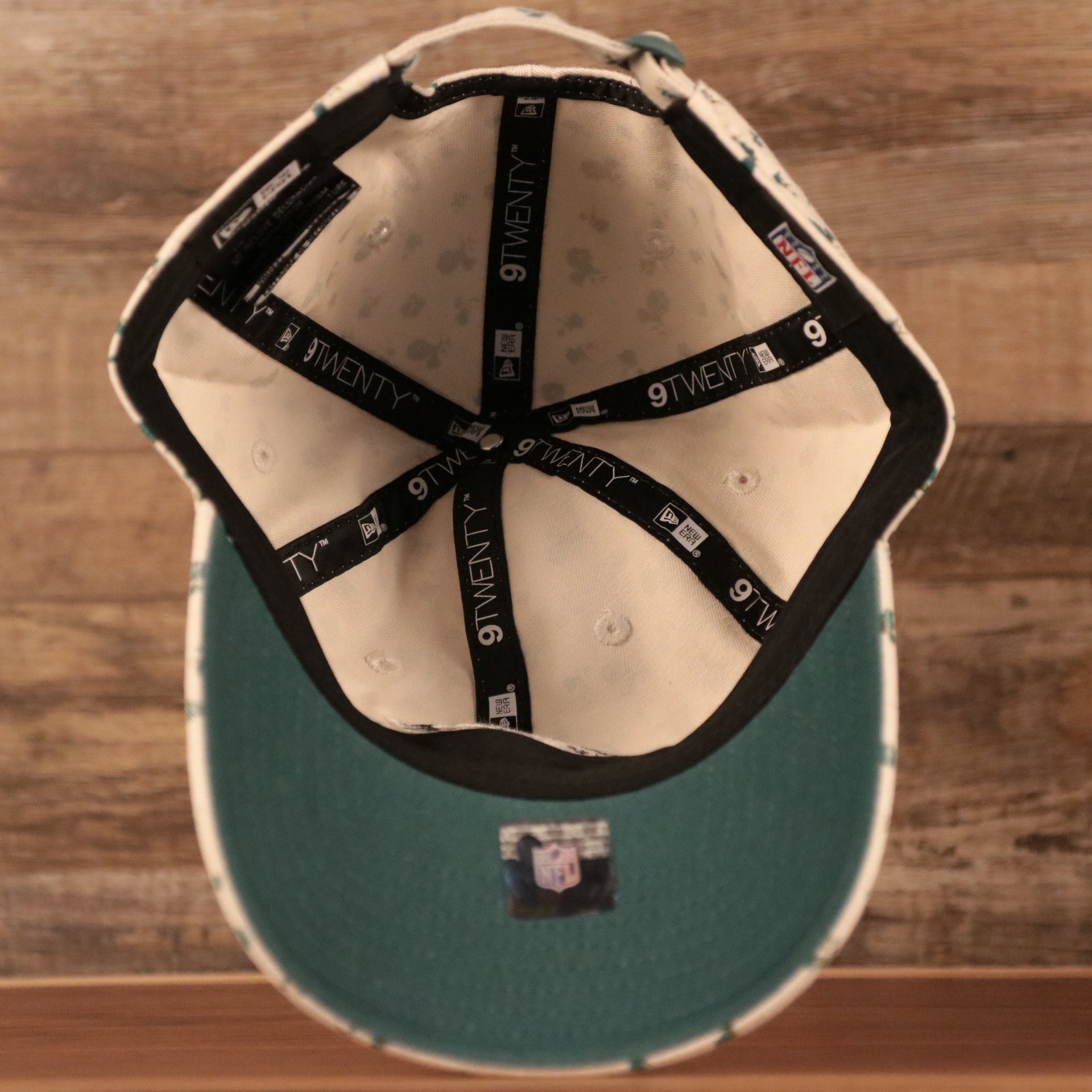 An inside view of the crown of the Philadelphia Eagles cream youth micro floral baseball dad hat.