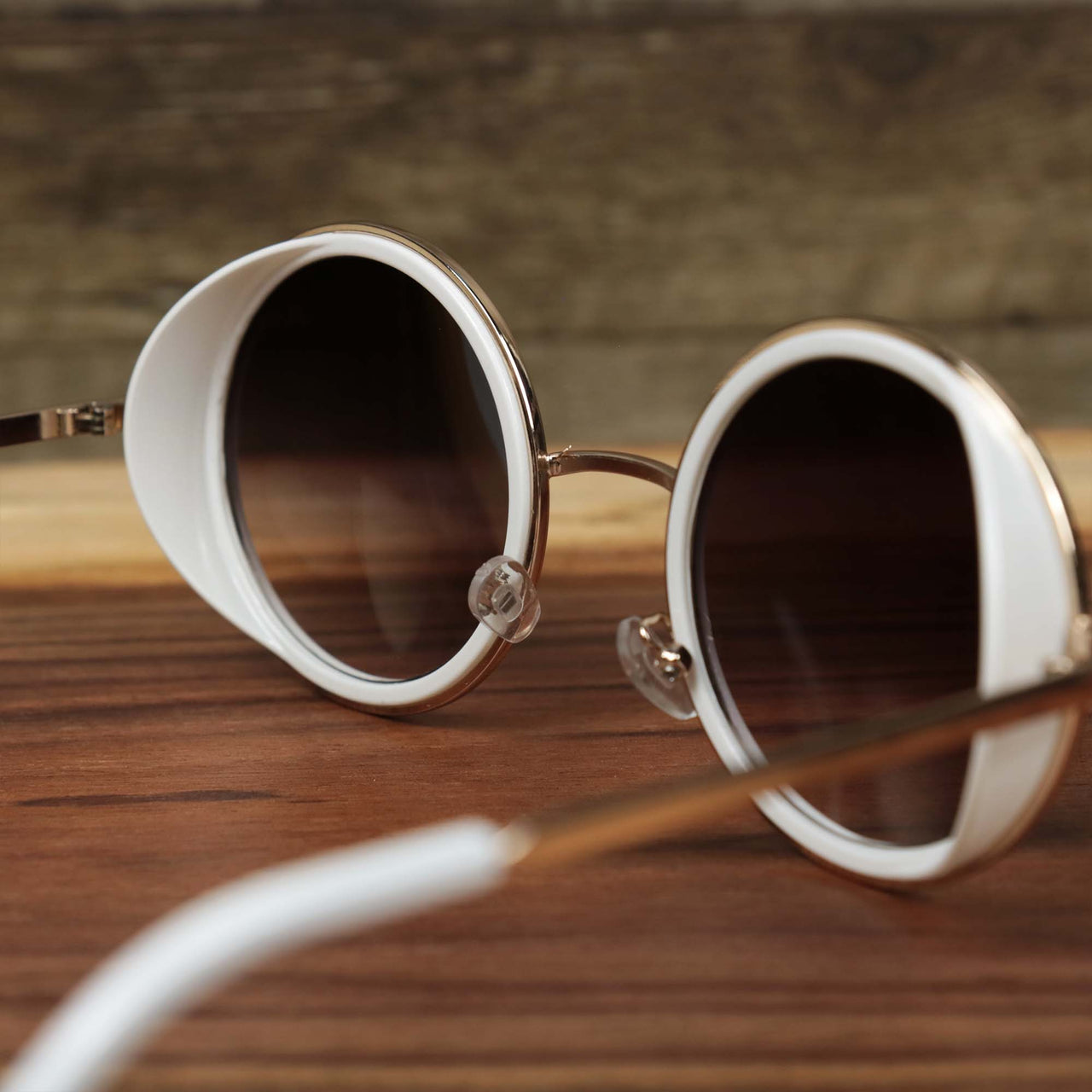 The back of the Circle Frame Black Lens Sunglasses with White Frame