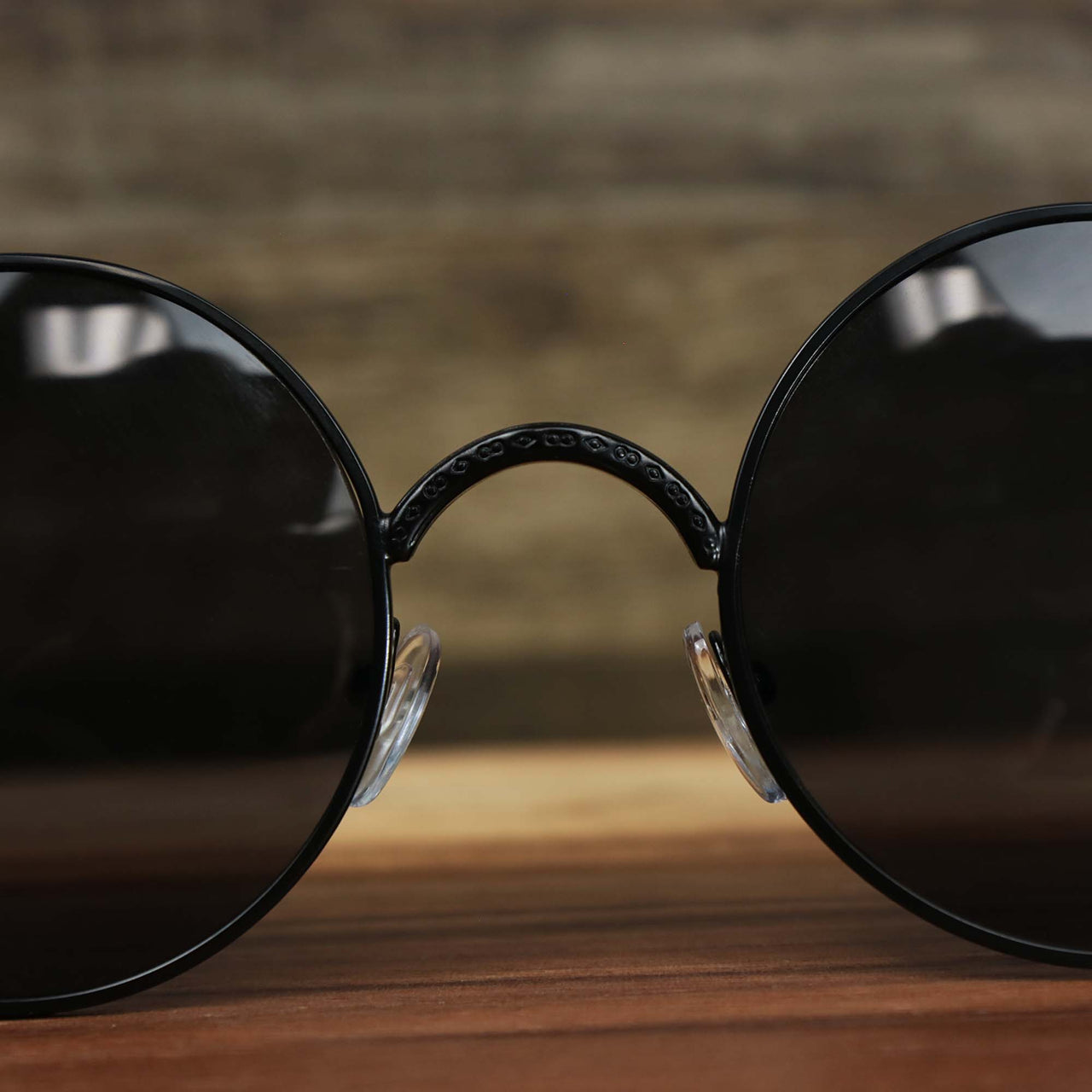 The bridge on the Round Frame Arched Bridge Black Lens Sunglasses with Black Frame