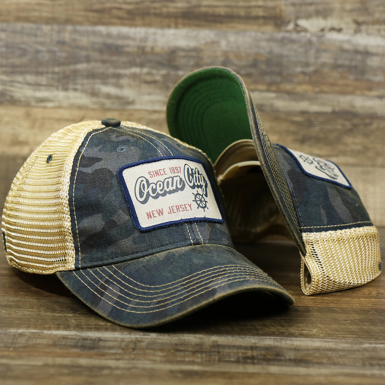 The Ocean City New Jersey Since 1897 Helm Patch Camo Print Mesh Back Trucker Hat | Camo Navy Blue Trucker Hat