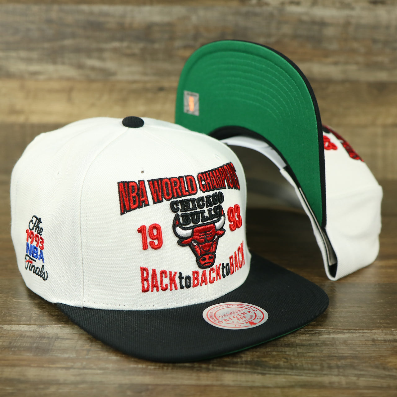 front and underbrim of the Chicago Bulls Vintage Retro NBA Champions 1993 Back To Back To Back Mitchell and Ness Snapback Hat | White