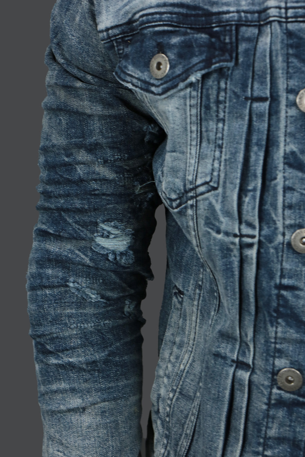 The Ripped Sleeves on the Deep Blue Distressed Denim Jacket | Jordan Craig