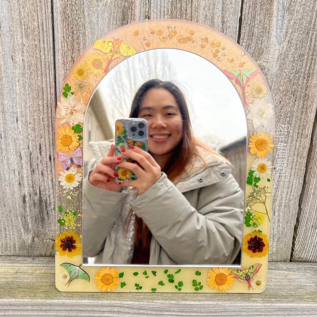 Ella Huang taking a picture in a resin mirror she made with High Performance Epoxy