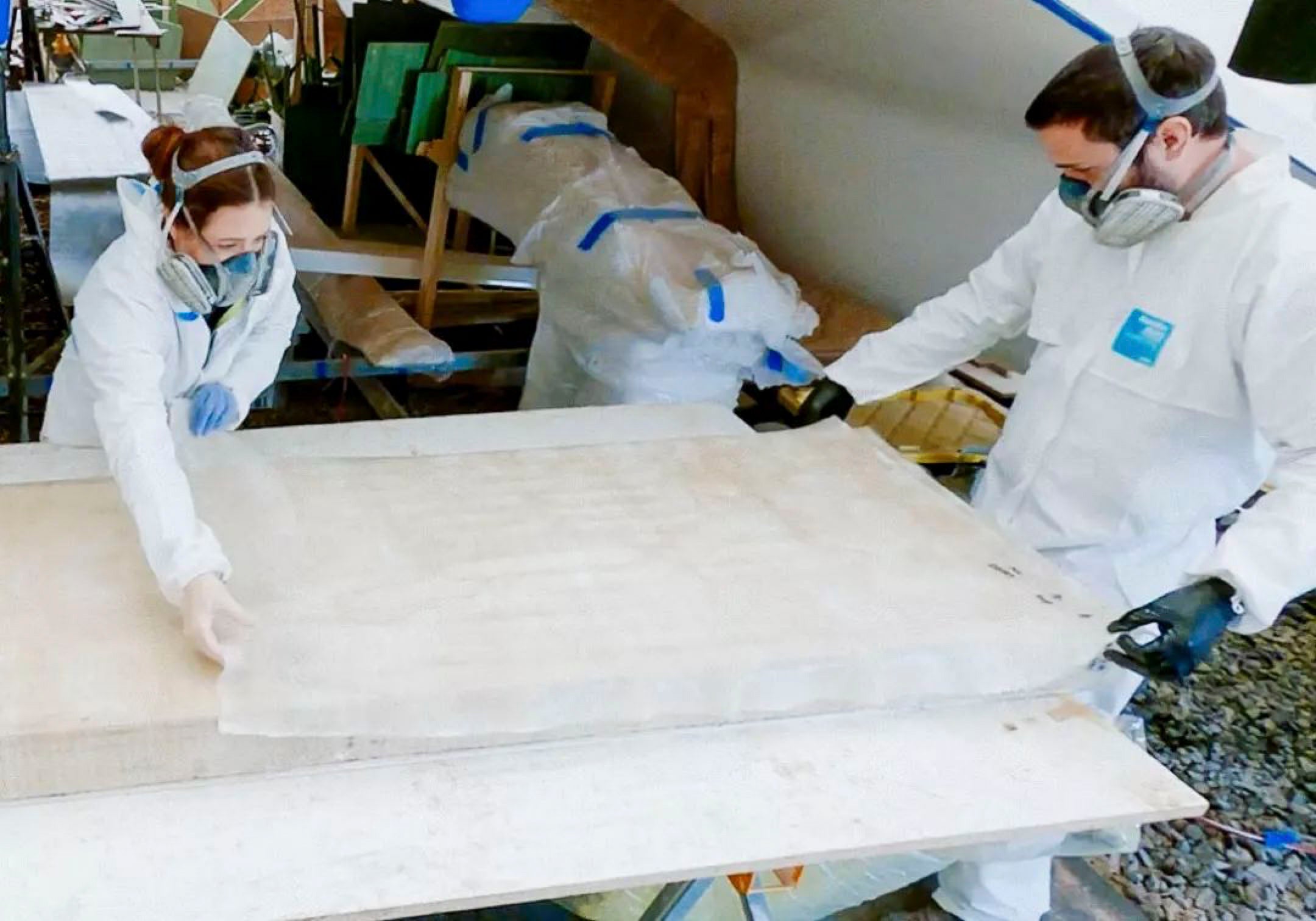 The Johnsons using TotalBoat High Performance Epoxy to glass their daggerboard case.