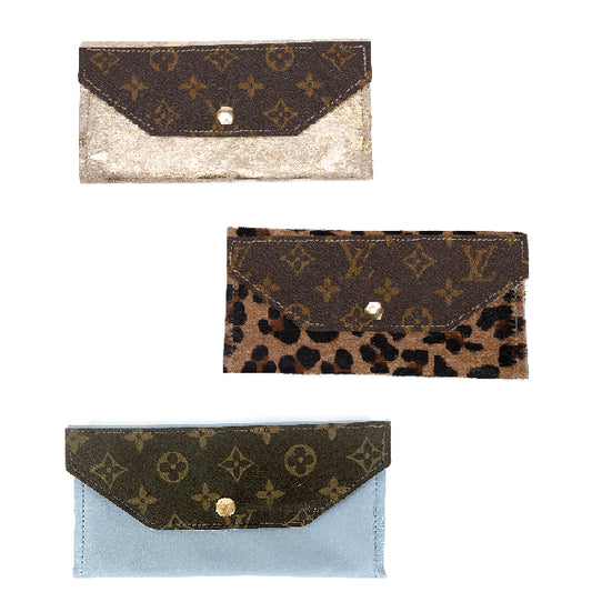 Love this Louis Vuitton && cowhide clutch with lots of handcut