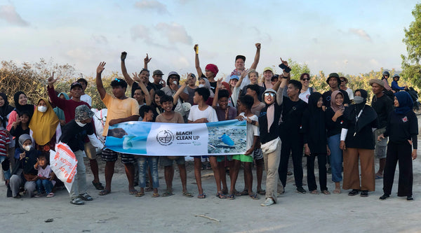 People cheering at the beach clean up in Lombok organised by Lombok Plastic Free