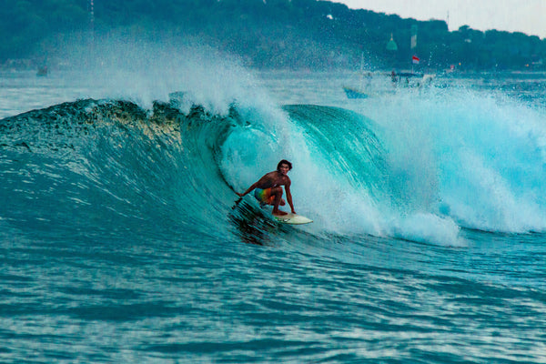 The Bali Surf Season: When to Visit for the Best Waves Surfing a wave