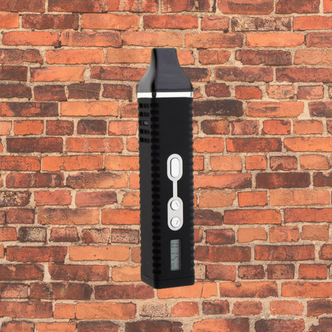 Titan 2 dry herb vaporizer in front of a brick wall 
