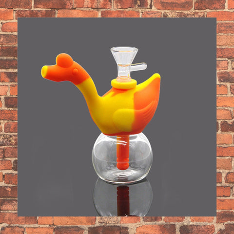 Orange and Yellow silicone bubbler with clear glass bottom brick background 