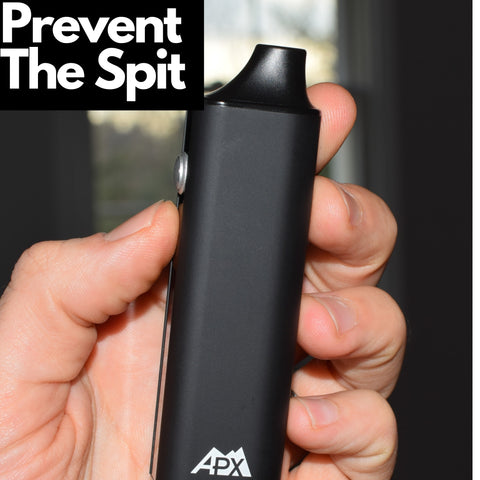 man holding vape up close with text saying "Prevent the spit