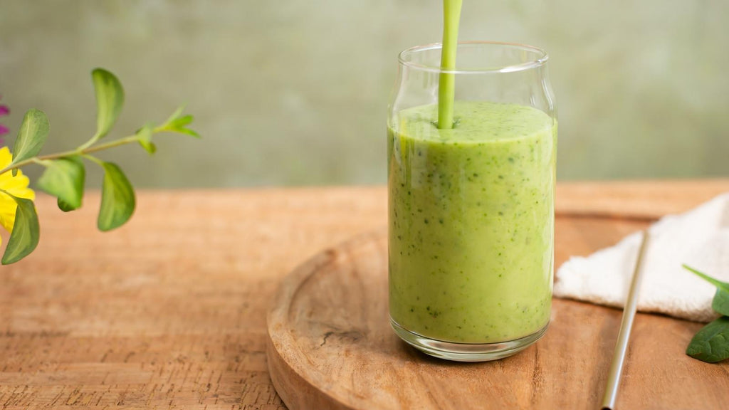 Green smoothie being poured into glass for shamrock shake remake recipe