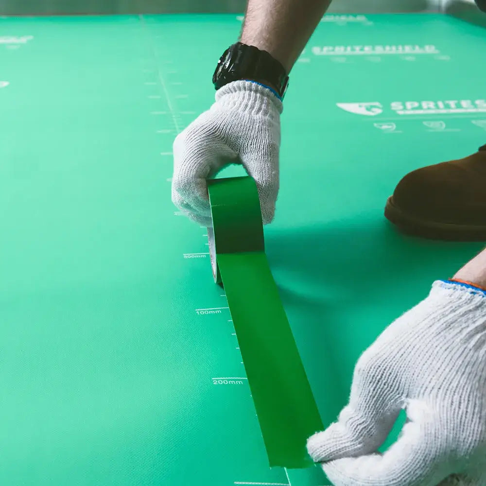 Construction worker examining protected floor