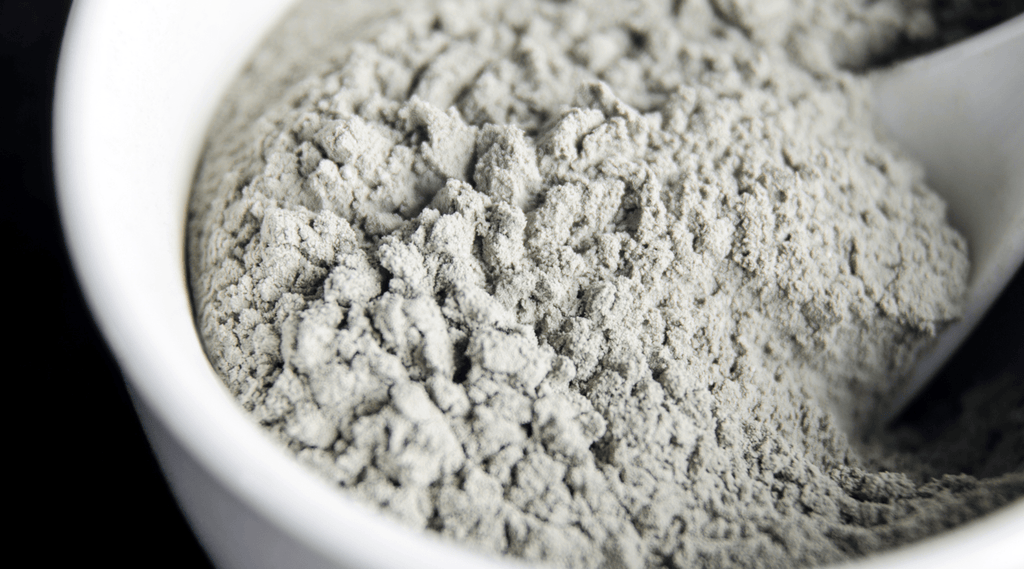 Bentonite clay is a natural clay derived from volcanic ash. It works on acne by absorbing excess oils, impurities, and toxins from the skin.