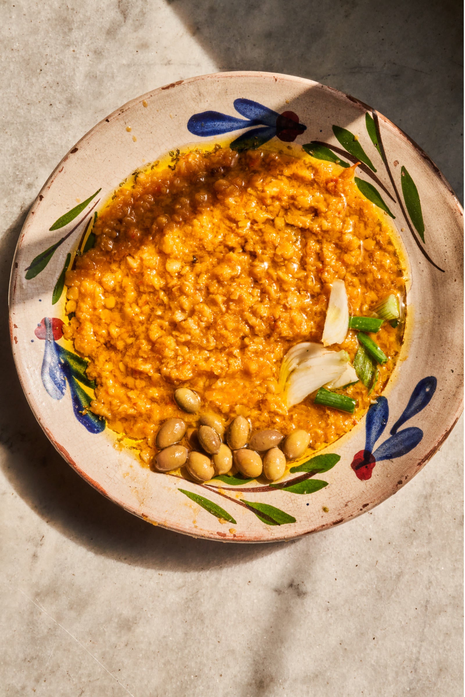 Cretan Red Lentils in a painted dish on a table in Greece