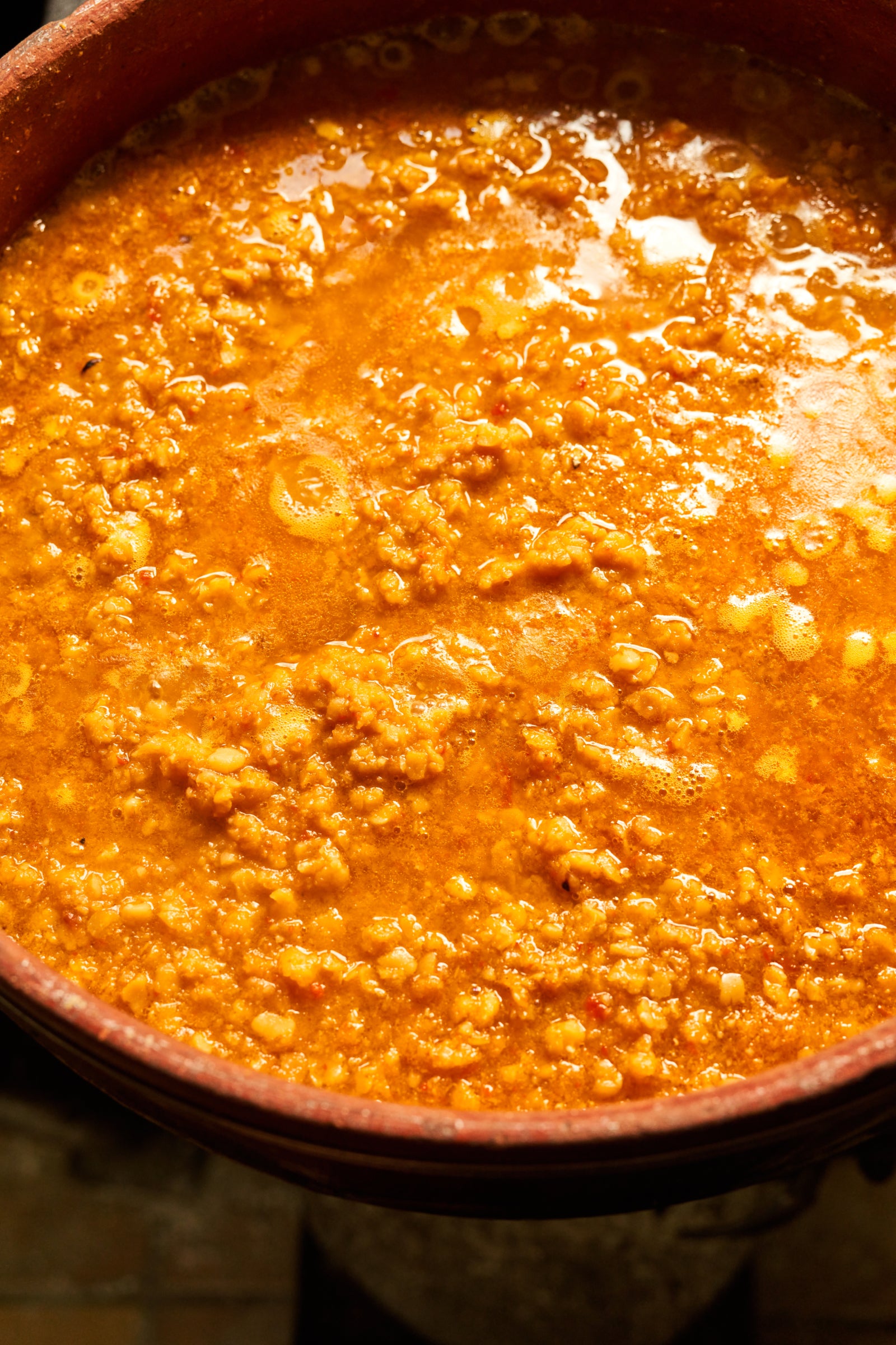 Cretan Red Lentils simmering in a clay pot in Greece