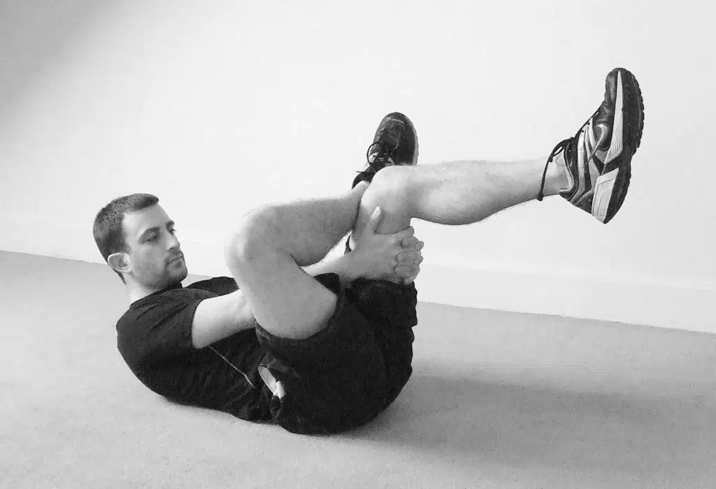 Lying crossover glute stretch