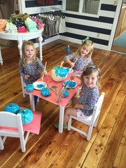 R to L: Charlotte, Kendal, and Scarlett paint their teal pumpkins!