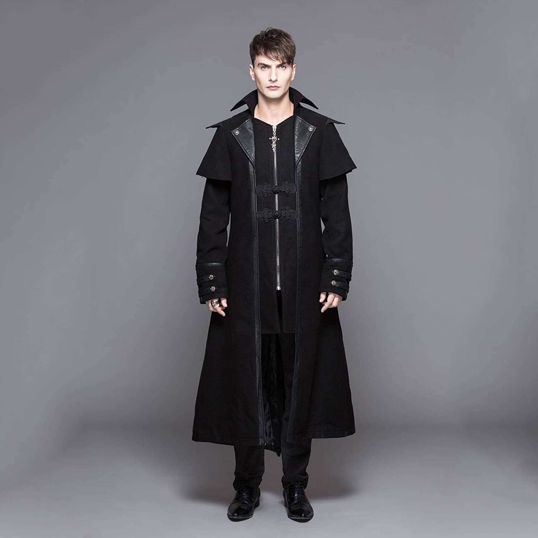 man-wearing-a-black-medieval-long-coat-in-grey-background_DDCJCT