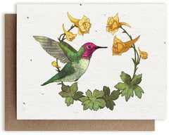 a Bower Studio Seed card featuring an illustration of a green and red Anna’s Hummingbird surrounded by yellow Larkspur