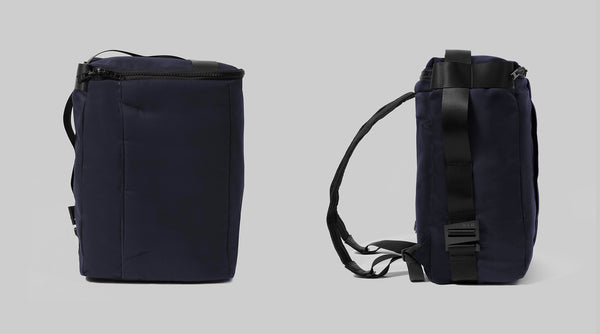 The Wright backpack in navy from two angles